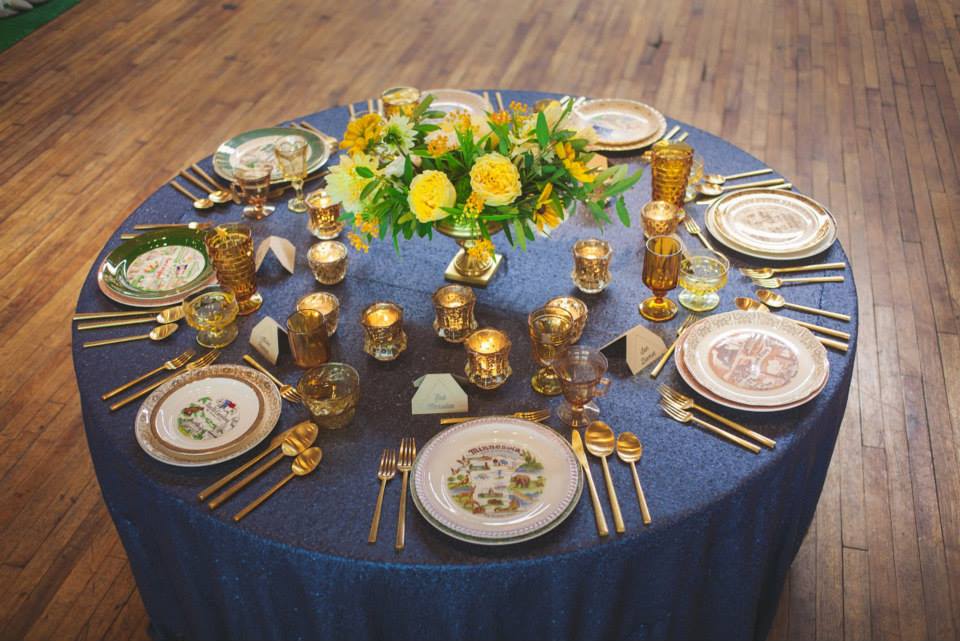 navy sequin with gold flatware and gold mercury glass
