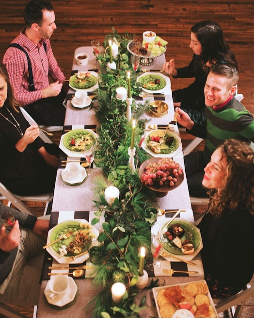 modern dinner party with foliage