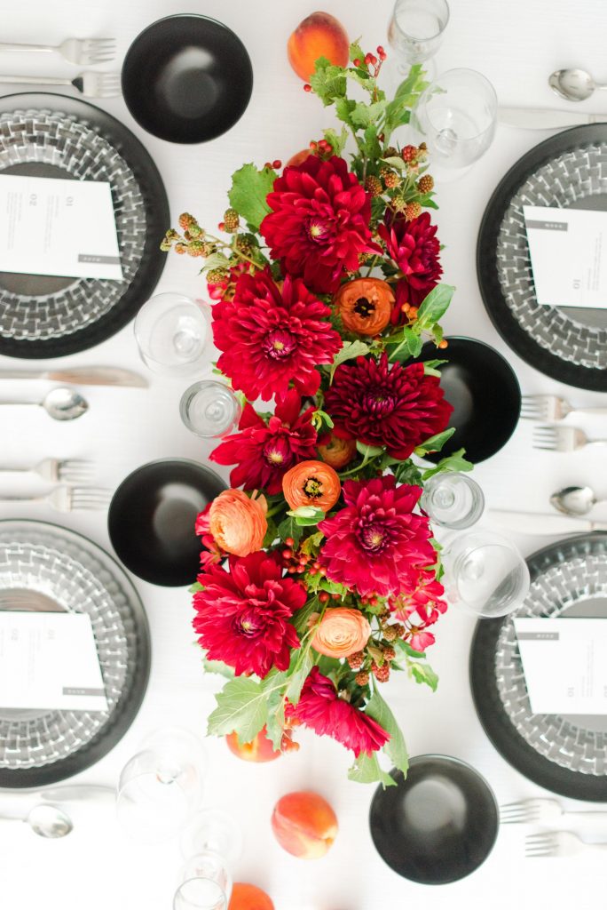 modern table decor red flowers crystal dinnerware event rentals modern table settings